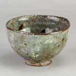 AKIKO HIRAI (born 1970); a stoneware chawan with textured surface covered in grey ash and celadon