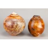 † ARDINE SPITTERS (born 1953); a smoke fired globular earthenware jar and cover with mottled