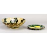 † RALPH JANDRELL (born 1965); a slip decorated earthenware bowl with an oak leaf pattern, painted RJ
