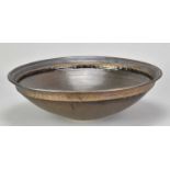 † ABDO NAGI (1941-2001); a large porcelain bowl covered in metallic bronze glaze, impressed mark,