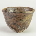 CHARLES BOUND (born 1939); a large wood fired stoneware cup covered in iron and green ash glaze,