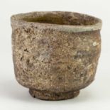 CHARLES BOUND (born 1939); a wood fired stoneware chawan covered in heavily ashed glaze, impressed