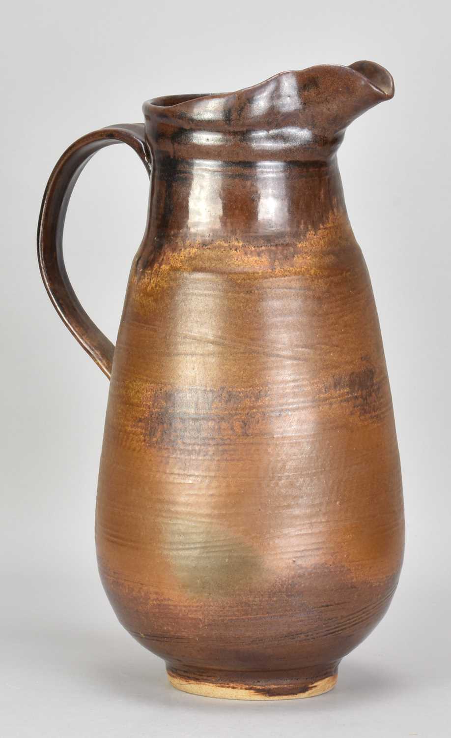 † ABDO NAGI (1941-2001); a tall stoneware jug covered in iron glaze, impressed marks, made 2000,