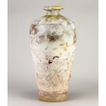 † ROBIN WELCH (1936-2019); a tall stoneware bottle covered in pinkish white glaze with red enamel