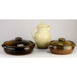 Winchcombe Pottery; a stoneware casserole covered in tenmoku breaking to kaki glaze with teadust
