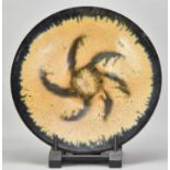 † ABDO NAGI (1941-2001); a stoneware charger/wall hanging covered in mottled yellow and blue glaze