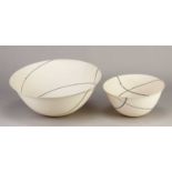 † ALISON GAUTREY; a translucent unglazed porcelain rocking bowl decorated with intersecting black