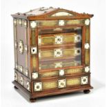 A 19th century brass bound oak jewellery cabinet with hat shaped top above a single glazed door