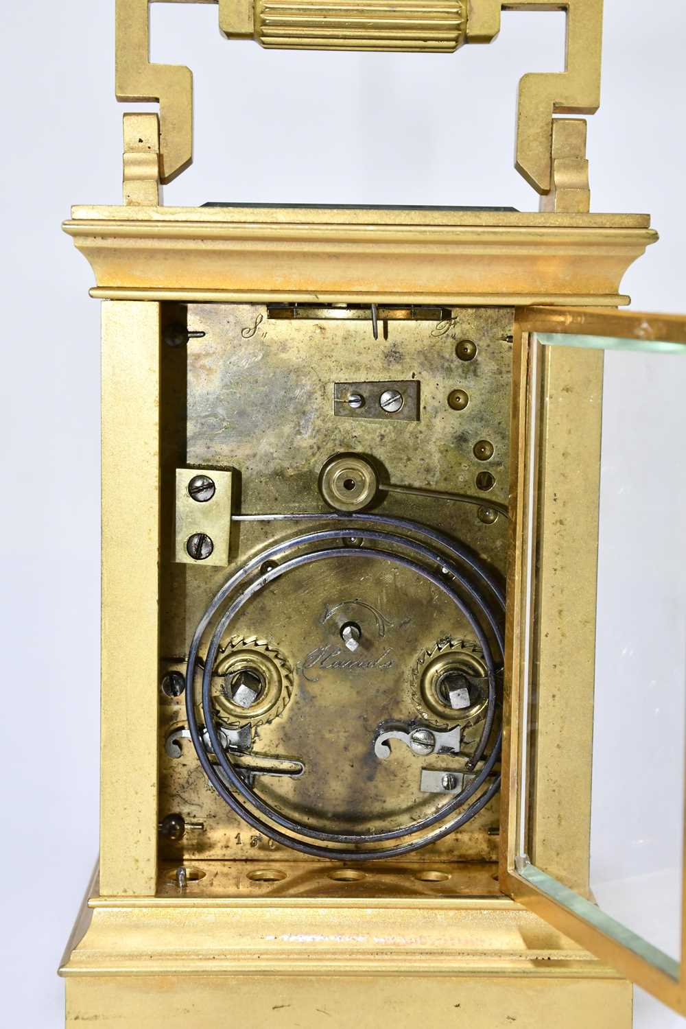 A late 19th century French brass cased carriage clock with swing loop handle above silvered dial set - Image 6 of 6