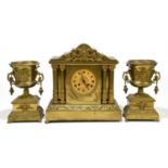 A late 19th century French gilt brass eight day clock garniture, with Roman numeral dial and