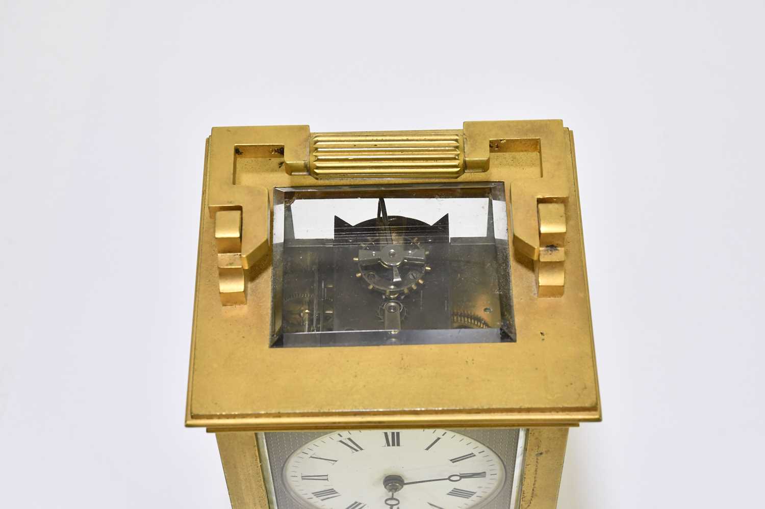 A late 19th century French brass cased carriage clock with swing loop handle above silvered dial set - Image 5 of 6