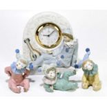 LLADRO; a figural mantel clock representing a jester seated beside a lute, with quartz movement,