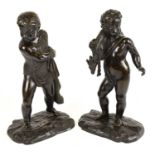 A large pair of late 19th century bronze figures, one depicting a cherubic figure with deer over his