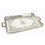 An Edwardian pierced silver plated twin handled tray of serpentine rectangular form, length 65cm.