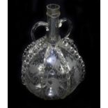 A late 18th century Dutch twin handled decanter, with applied ribbing and etched floral detailing,
