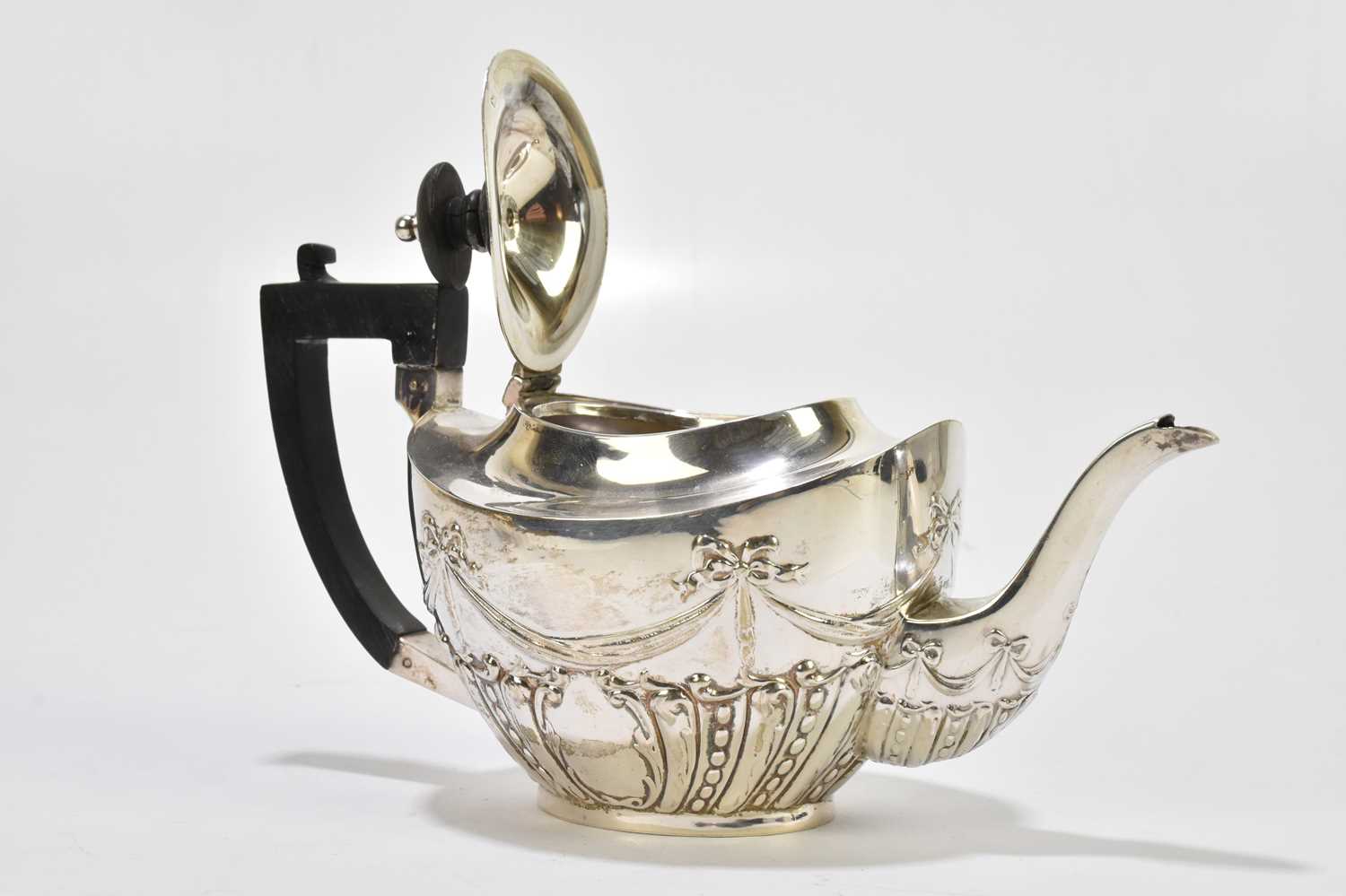 WILLIAM J HOLMES; an Edward VII hallmarked silver three piece bachelor's tea service, repoussé - Image 2 of 5