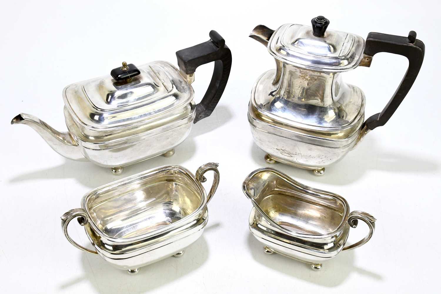 HARRISON BROS & HOWSON; a George V hallmarked silver four piece tea service of square form, on