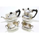 HARRISON BROS & HOWSON; a George V hallmarked silver four piece tea service of square form, on