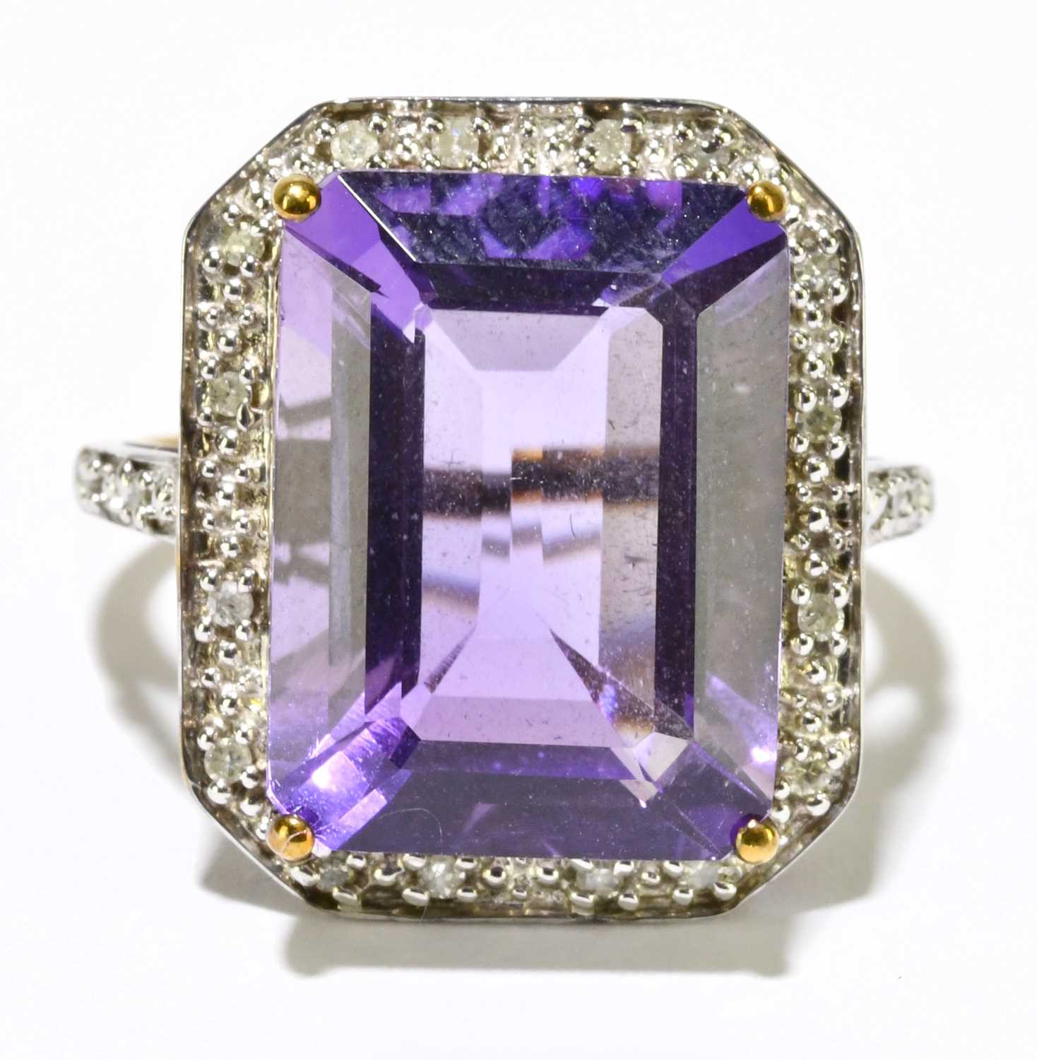 A 9ct yellow gold ring set with large emerald cut amethyst, size N 1/2, approx. 4.78g.