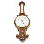 WOOD (LATE ABRAHAM) MANCHESTER & LIVERPOOL; a late Victorian carved oak aneroid barometer, with