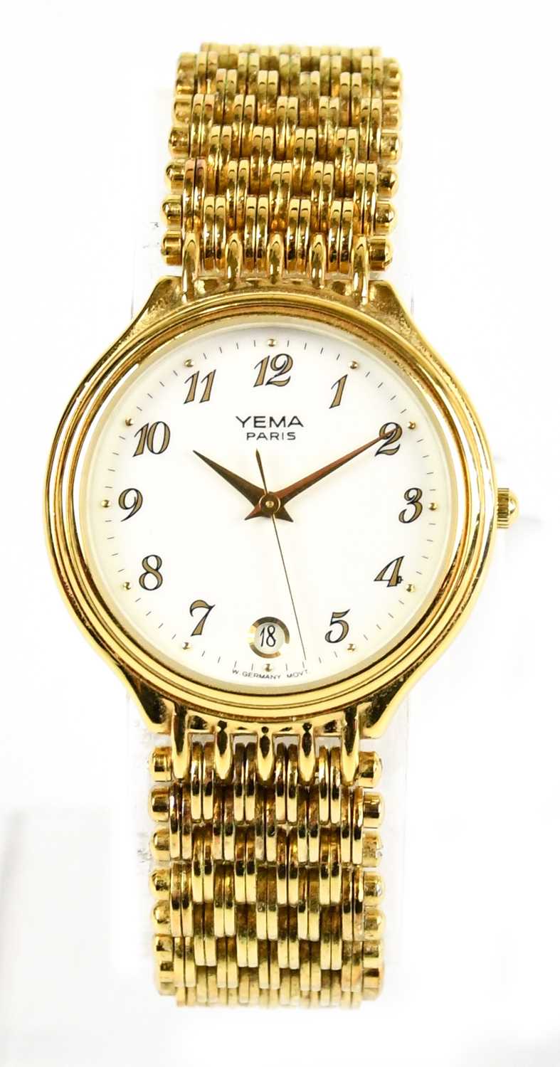 YEMA; a gold tone vintage quartz watch with bracelet strap, white ceramic face and spare chain and