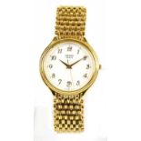 YEMA; a gold tone vintage quartz watch with bracelet strap, white ceramic face and spare chain and