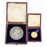 A cased yellow metal and a cased white metal 1837-1897 Queen Victorian Jubilee medallions, the