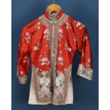 A red 1960s silk satin lined Chinese jacket with a floral embroidered pattern to front and back with