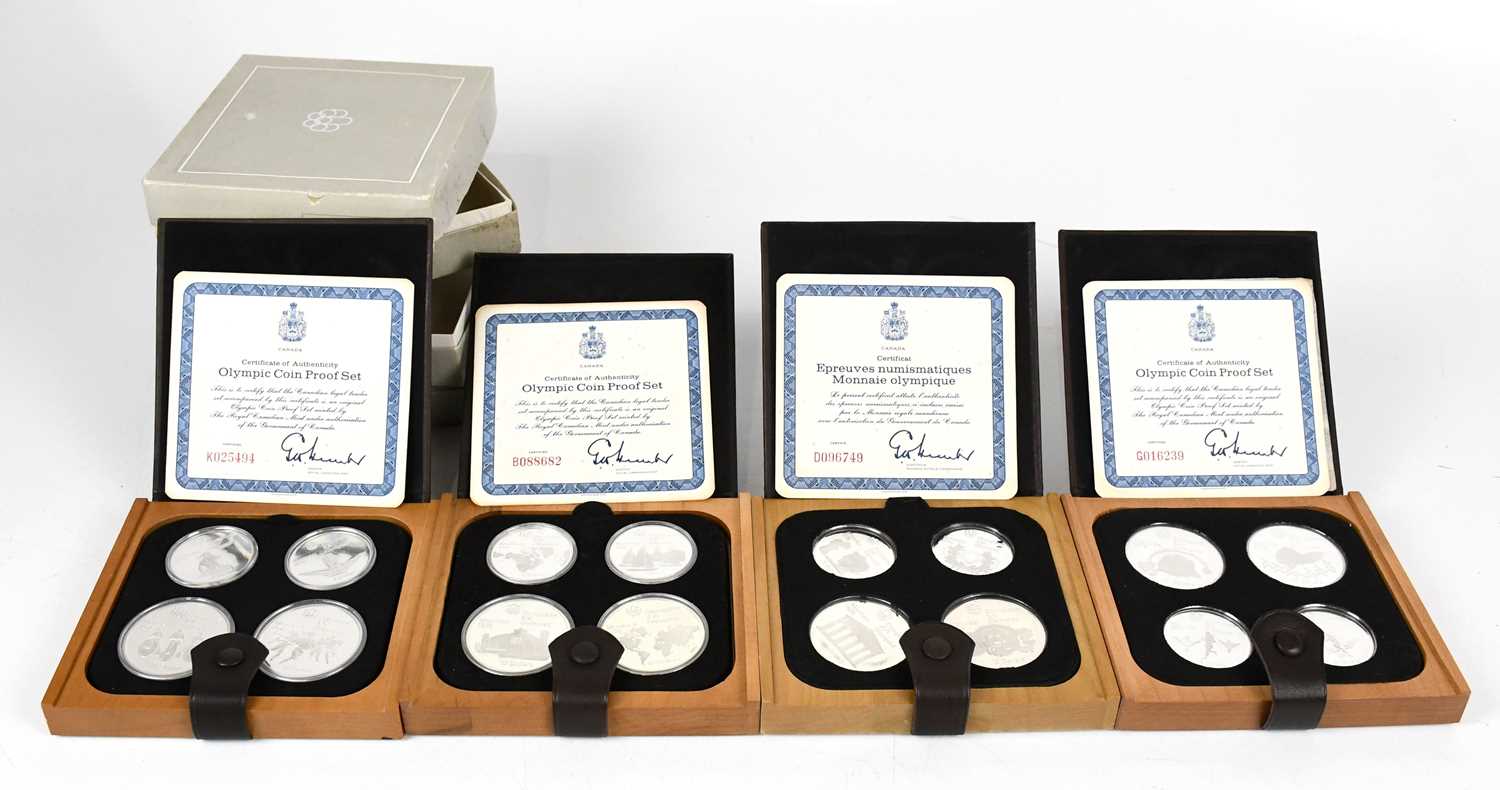 ROYAL CANADIAN MINT; four 1976 Montreal Olympic silver proof coin sets, boxed with certificates,