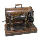 SINGER; a manual sewing machine, cased.