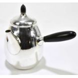 GEORG JENSEN; a hammered silver coffee pot, shaped no. 80B, with turned ebony acorn finial and