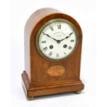 PARKINSON & FRODSHAM; an Edwardian inlaid mahogany cased dome topped mantel clock, on four brass