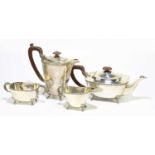 CHARLES S GREEN & CO; a George VI hallmarked silver four piece tea service of square form, with cast