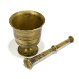 A 19th century brass pestle and mortar, height of mortar 12cm (2).Condition Report: Age wear