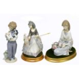 LLADRO; three figures comprising 1988 Collectors' Society figure of a seated girl with flowers,