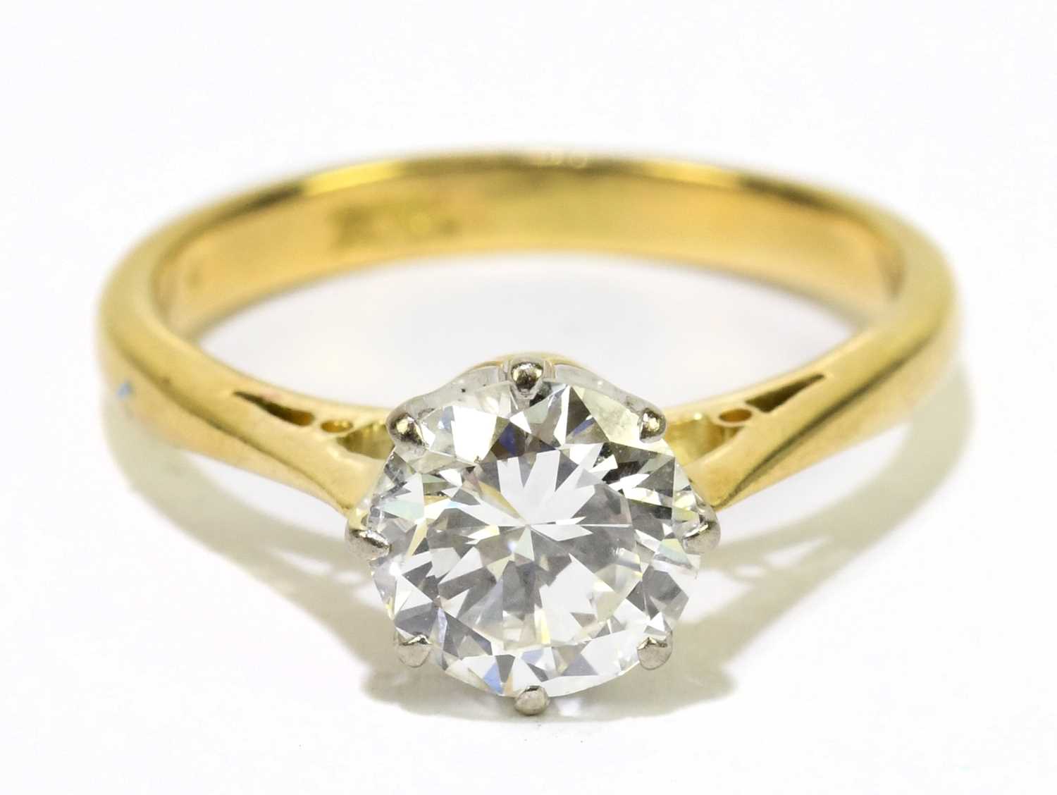 An 18ct yellow gold and diamond solitaire ring, the round brilliant cut eight claw set stone approx. - Image 2 of 5