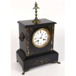 A Victorian marble and slate mantel clock with brass spike finial above the enamel dial set with