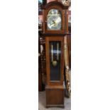 A reproduction mahogany cased longcase clock of small proportions with brass face and silvered