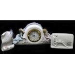 LLADRO; a figural mantel time piece, no 5776, with two Lladro stands, tallest 14cm. (3).Condition