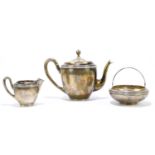 X A French white metal three piece tea set to include teapot, cream jug and sugar bowl (3). Ivory