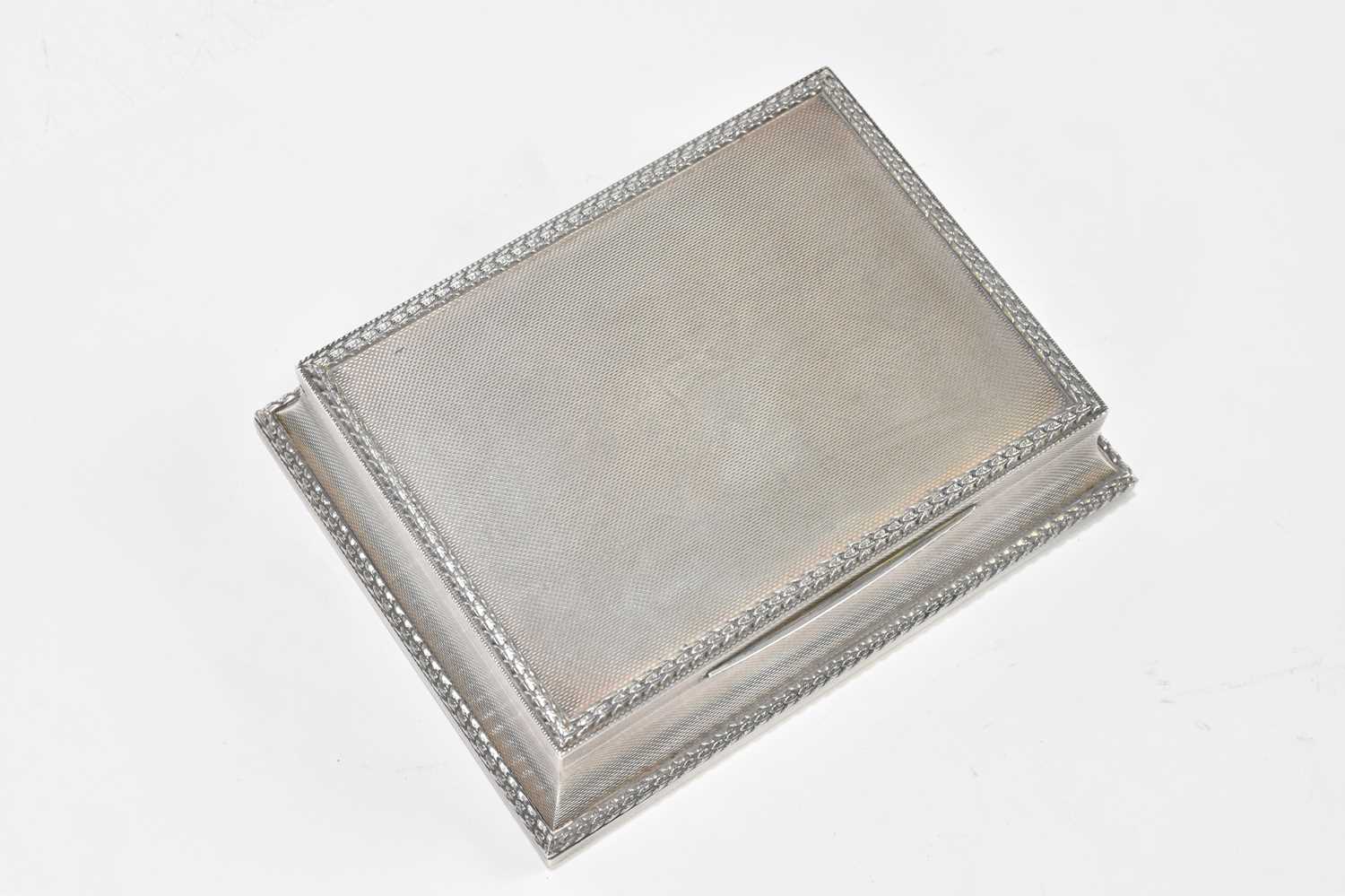 ASPREY & CO; an Elizabeth II hallmarked silver cigarette box of shaped rectangular form, with cast - Image 6 of 8