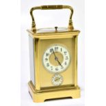 A circa 1900 French brass repeating carriage clock with Arabic numerals to the chapter ring set