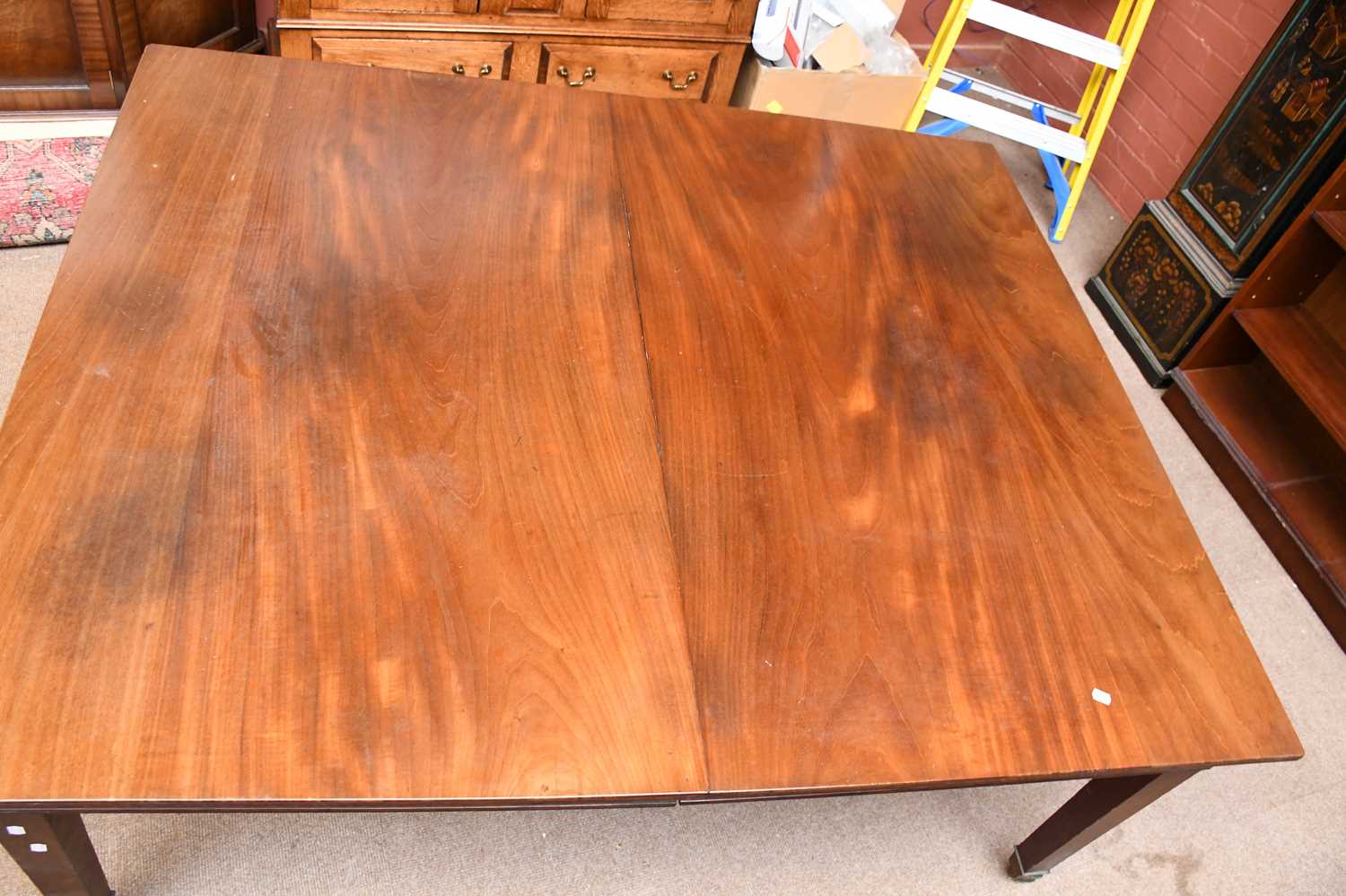 An Edwardian mahogany extending dining table of George III design, with two spare leaves, on tapered - Image 2 of 2