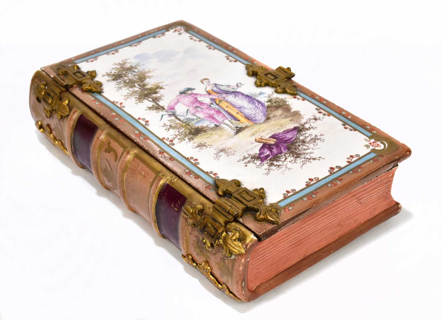 A 19th century French pottery faïence ware trinket box in the form of a book with gilt metal mounts,