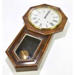 An American rosewood cased wall clock, the painted dial set with Roman numerals above a shaped glass