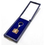 ROLLS ROYCE; a 9ct gold key fob modelled as a Rolls Royce grill, weight 18.4g, in fitted case.
