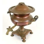 A 19th century copper twin handled tea urn on four pad feet, height 39 cm.
