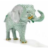 HEREND; a large model of an elephant with green fishnet and gilt decoration, height 25cm, length
