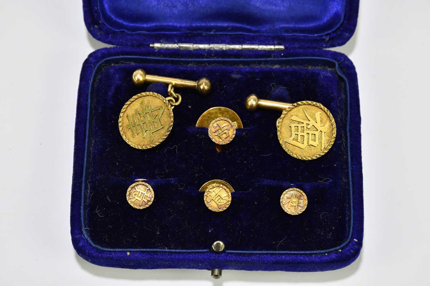 A pair of yellow metal cufflinks set with Chinese characters to the circular platforms and the - Image 2 of 2