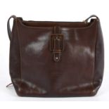 VALENTINO; a brown leather shoulder bag with leather buckle and embossed maker's logo to front,